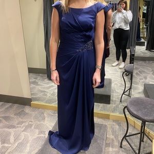 Mother of the bride dress with tags still attached.  Never worn.  Navy.  Size 6.